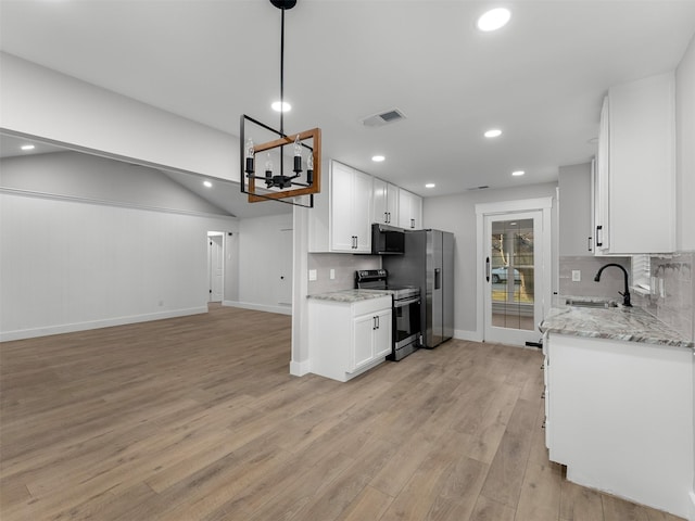 kitchen featuring light hardwood / wood-style floors, sink, appliances with stainless steel finishes, white cabinets, and light stone counters