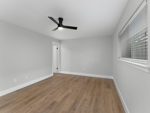 spare room with light hardwood / wood-style floors and ceiling fan