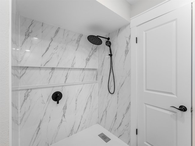 bathroom with a tile shower