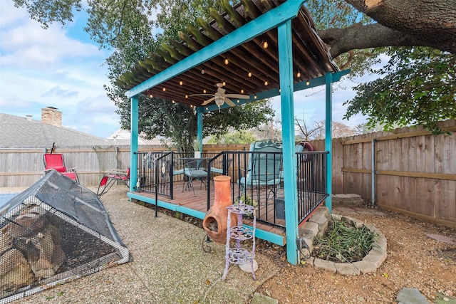 view of play area featuring a wooden deck and ceiling fan