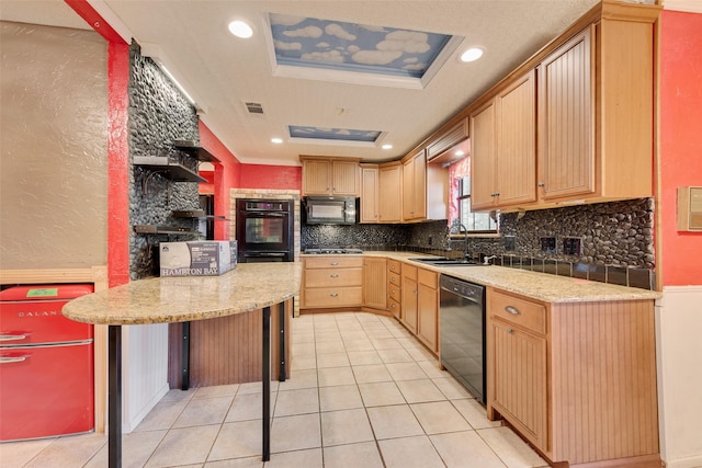 226 Meadowlark Ln, Duncanville, TX 75137 - kitchen with a sink, visible vents, backsplash, black appliances, and light tile patterned floors