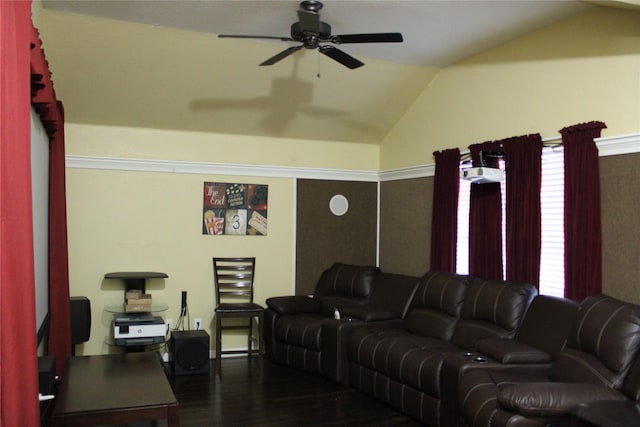 living room with dark wood-type flooring, ceiling fan, and vaulted ceiling