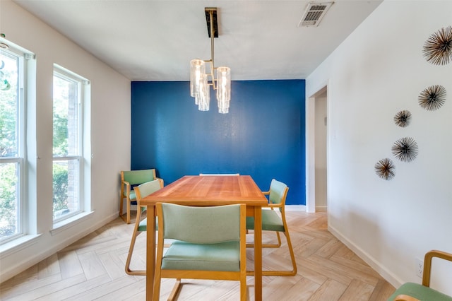 dining space with light parquet floors