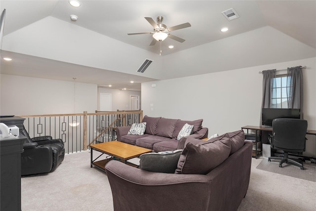 living room with ceiling fan, light colored carpet, and a raised ceiling