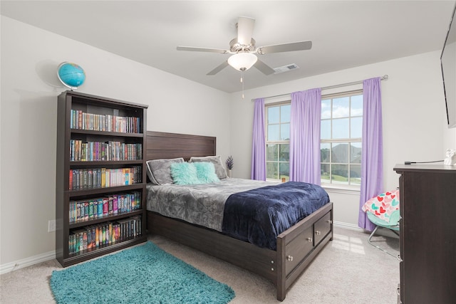 bedroom featuring ceiling fan and light colored carpet