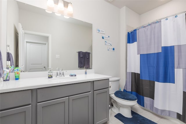 bathroom featuring toilet, vanity, walk in shower, and tile patterned flooring