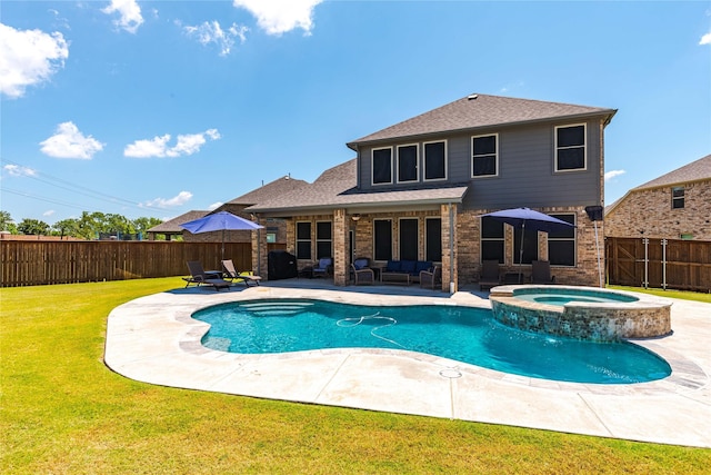 view of swimming pool featuring an in ground hot tub, a patio area, a yard, and an outdoor hangout area