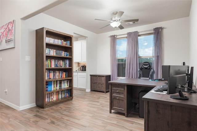 office featuring ceiling fan and light hardwood / wood-style floors