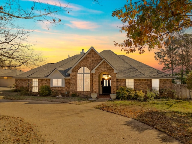 view of front of house with a yard