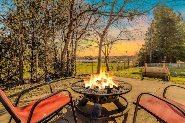 patio terrace at dusk with a fire pit