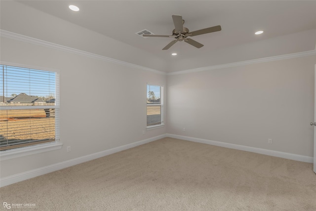 empty room with carpet floors, ornamental molding, and ceiling fan