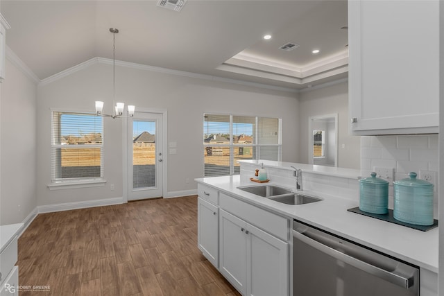 kitchen featuring white cabinetry, dishwasher, hanging light fixtures, crown molding, and sink