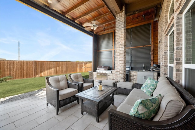 view of patio / terrace featuring an outdoor hangout area, ceiling fan, area for grilling, and sink