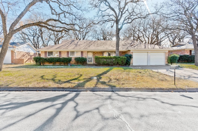 single story home featuring a garage and a front yard