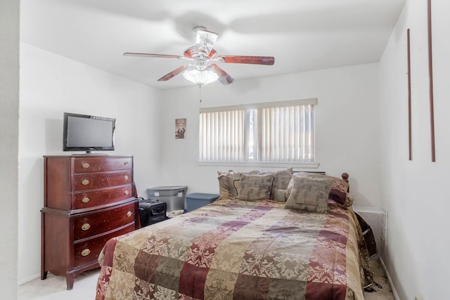 bedroom with ceiling fan and light colored carpet