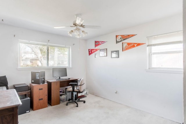 home office with ceiling fan and light colored carpet