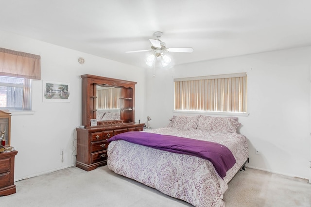 bedroom featuring ceiling fan and light colored carpet