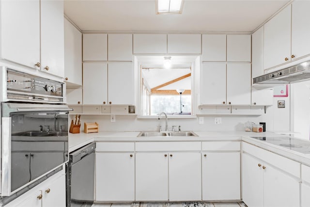 kitchen with white cabinetry, stainless steel oven, dishwasher, electric cooktop, and sink