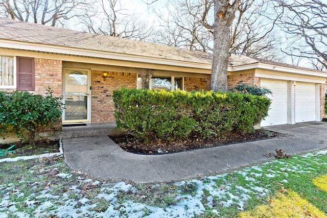 doorway to property featuring a garage