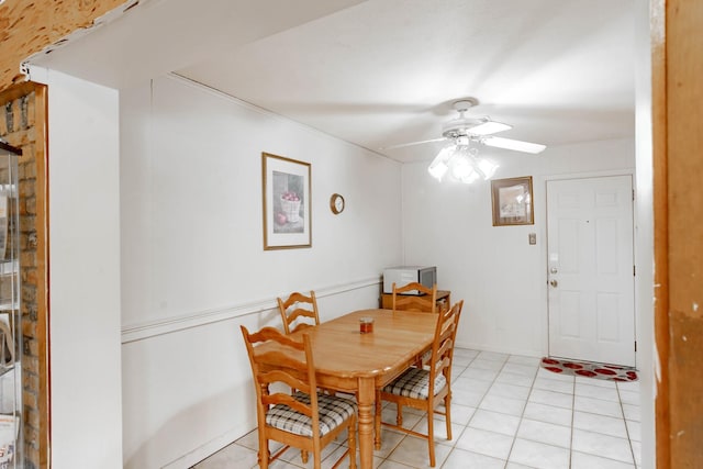 dining area with ceiling fan and light tile patterned floors