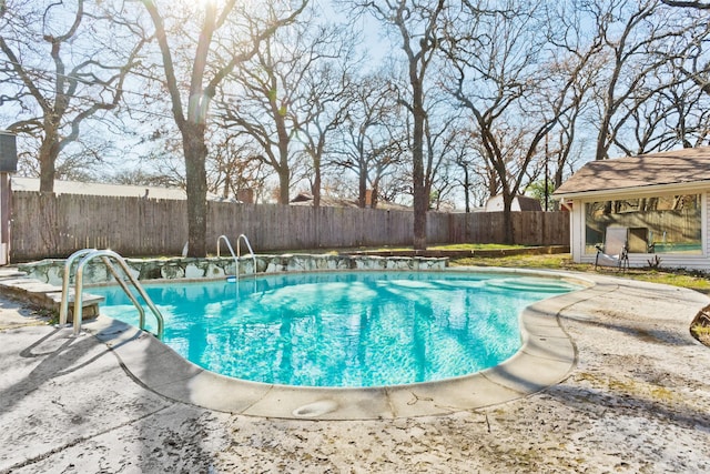 view of swimming pool with a patio area