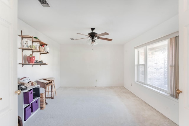 carpeted empty room with ceiling fan