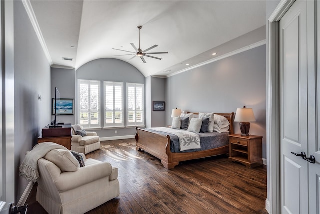 bedroom with ceiling fan, vaulted ceiling, dark wood-type flooring, and ornamental molding