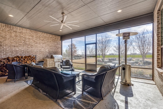 sunroom / solarium with ceiling fan