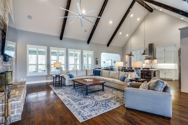 living room featuring high vaulted ceiling, dark hardwood / wood-style floors, and beamed ceiling