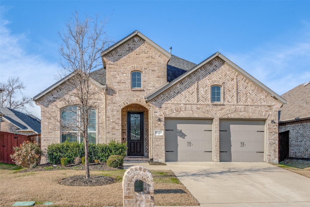 french country home with a garage