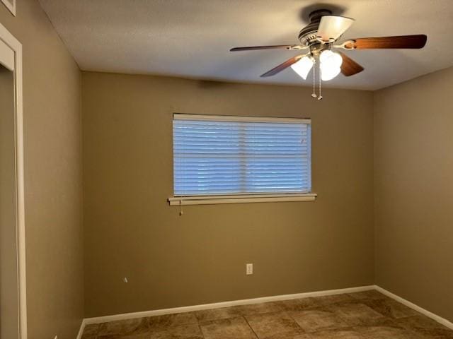 unfurnished room with ceiling fan