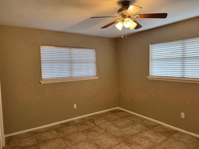 unfurnished room with ceiling fan