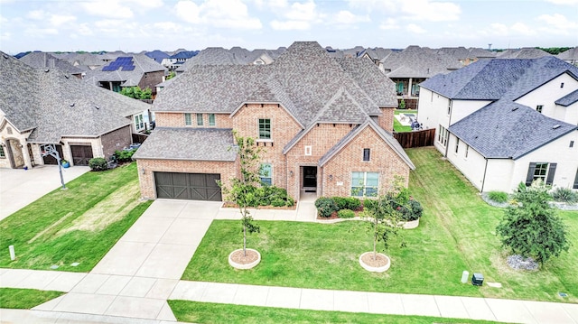 view of front of home featuring a garage and a front yard