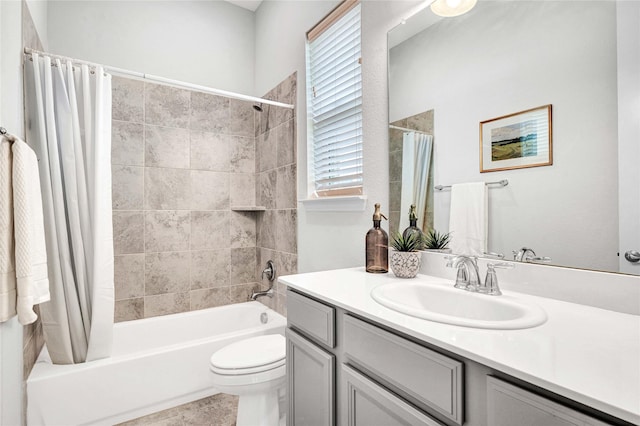 bathroom featuring vanity, toilet, and shower / tub combo with curtain