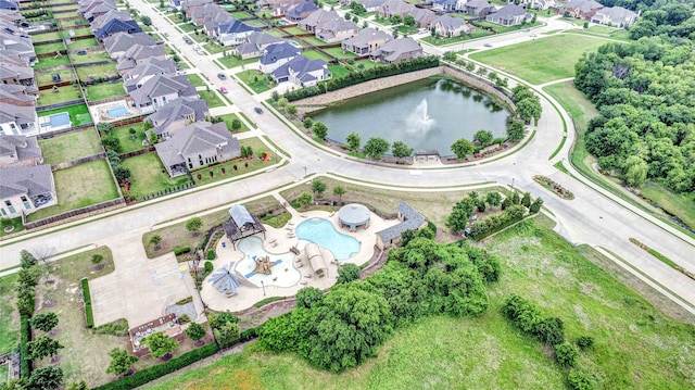 bird's eye view with a residential view and a water view