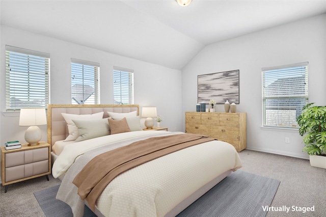 bedroom with light carpet, baseboards, and lofted ceiling