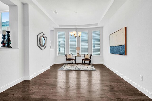 dining space with a notable chandelier, visible vents, baseboards, and dark wood-style flooring