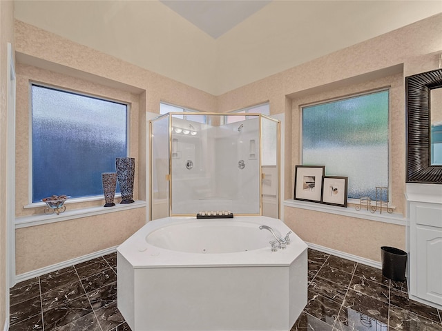 bathroom with shower with separate bathtub