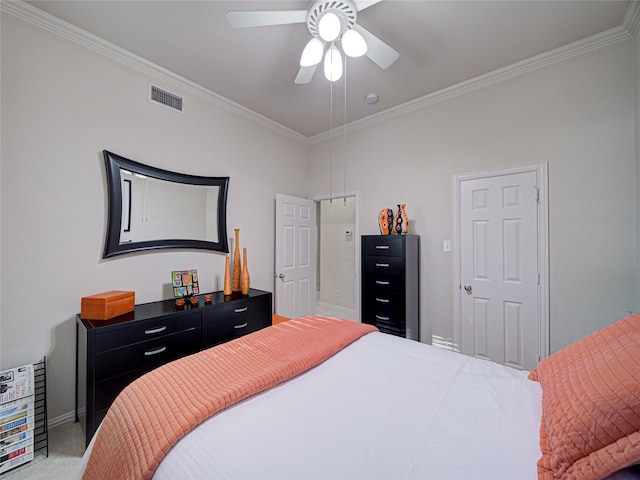 carpeted bedroom featuring ceiling fan and crown molding