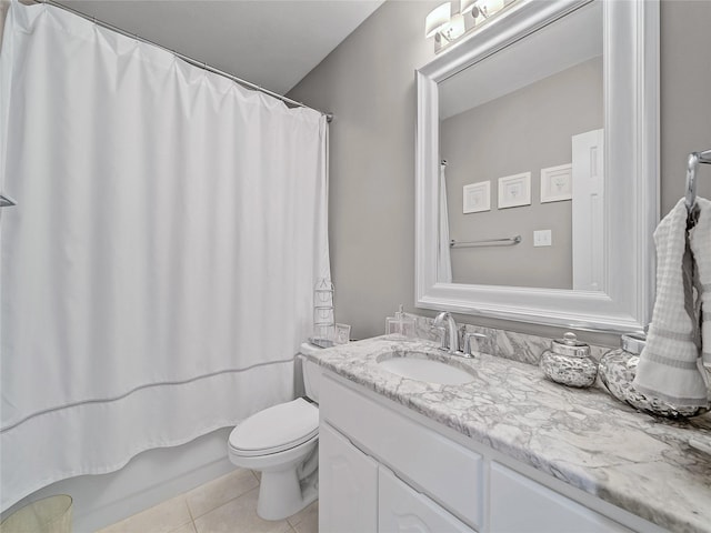 full bathroom featuring toilet, vanity, tile patterned flooring, and shower / bath combination with curtain