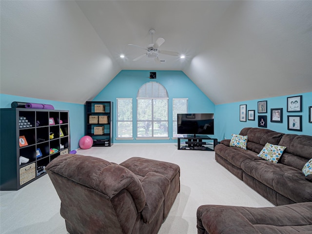 carpeted living room featuring vaulted ceiling and ceiling fan