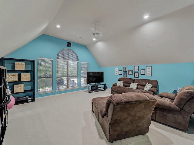 carpeted living room with vaulted ceiling and ceiling fan