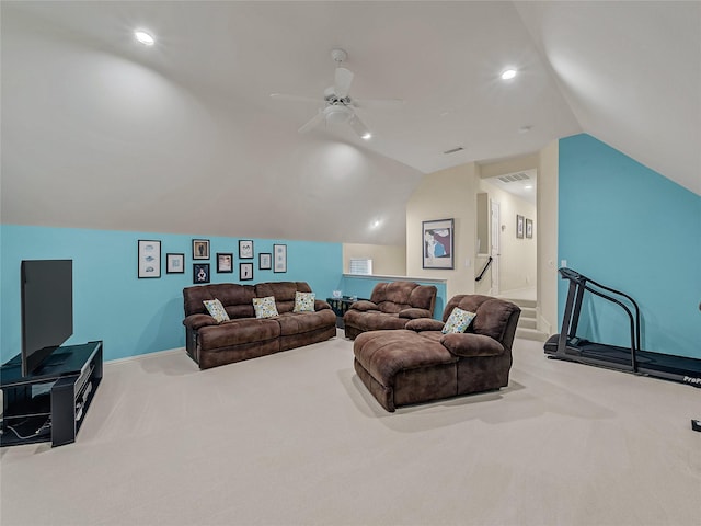 living room featuring lofted ceiling, light colored carpet, and ceiling fan