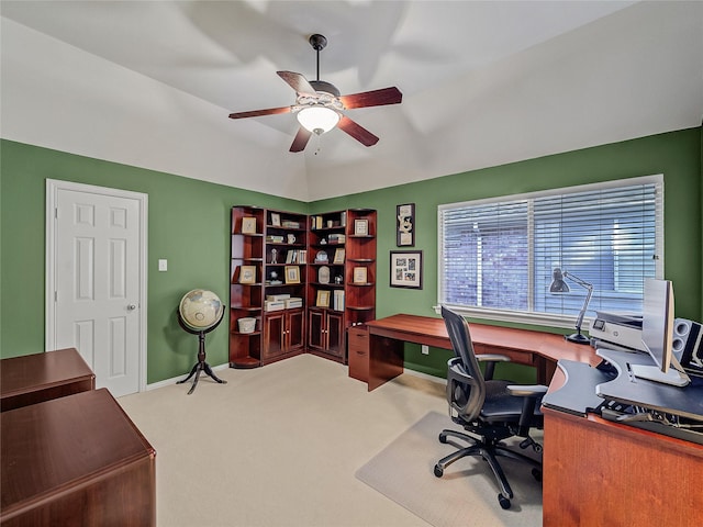 office featuring ceiling fan, light carpet, and vaulted ceiling