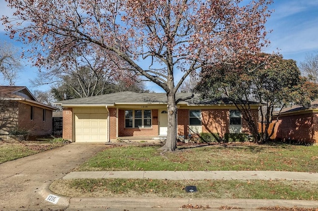 view of front of home with a garage and a front lawn