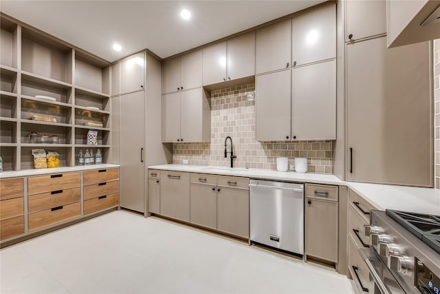 kitchen featuring sink, appliances with stainless steel finishes, and tasteful backsplash