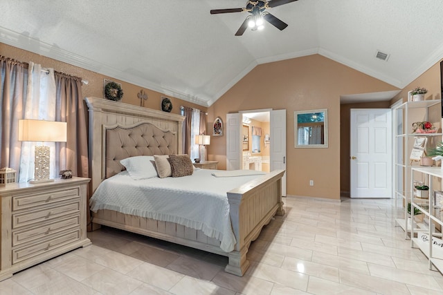 tiled bedroom featuring ceiling fan, a textured ceiling, ensuite bathroom, and vaulted ceiling