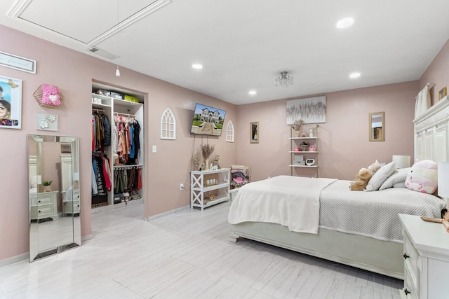 bedroom featuring a closet and a walk in closet