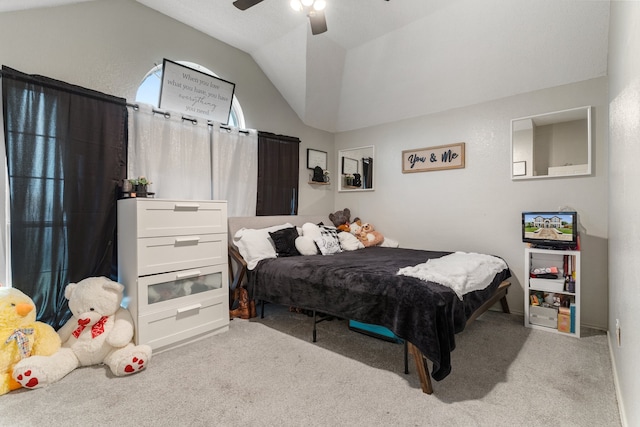 bedroom featuring ceiling fan, light colored carpet, and vaulted ceiling