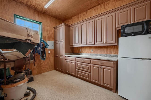 interior space with white fridge, wooden ceiling, and wooden walls